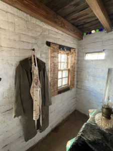 slump stone adobe-style shed