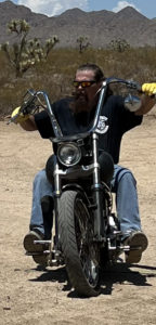 riding a Harley motorcycle in the desert