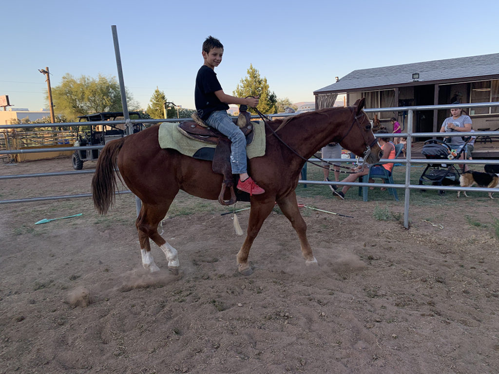 boy riding horse