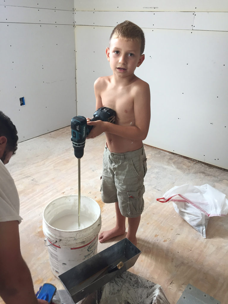 boy working with sheetrock